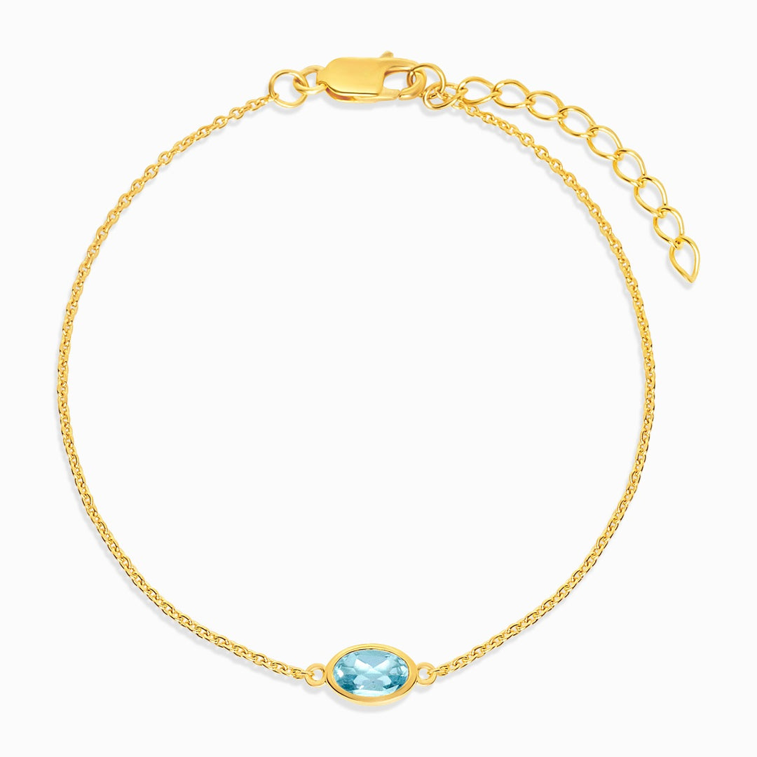 Armband mit Geburtssteinen für Dezember in Gold mit blauem Topas. Kristallarmband mit blauem Topas in Gold.