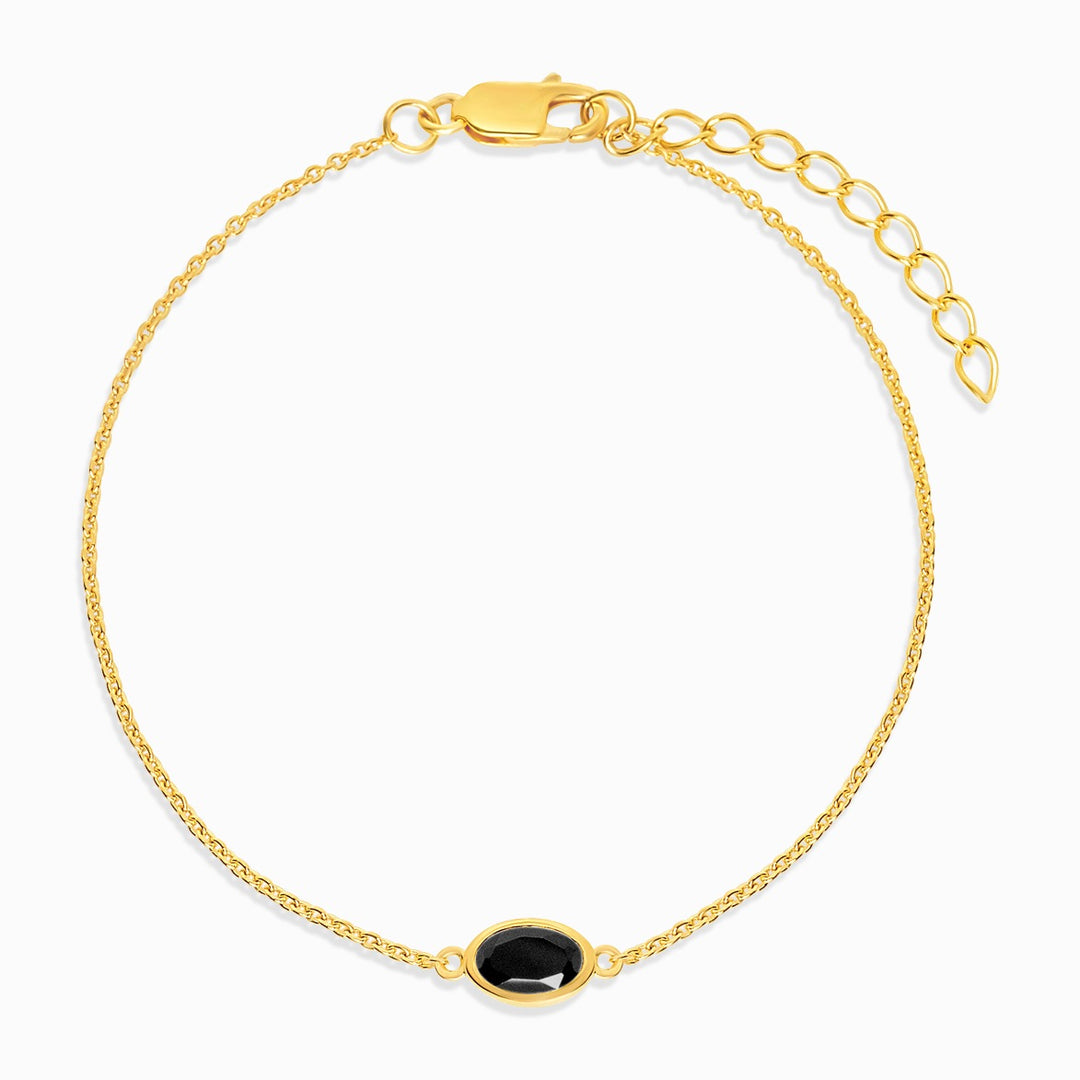 Armband mit schwarzem Kristall-Onyx in Gold. Edelsteinarmband mit Onyx-Geburtsstein für Juli.