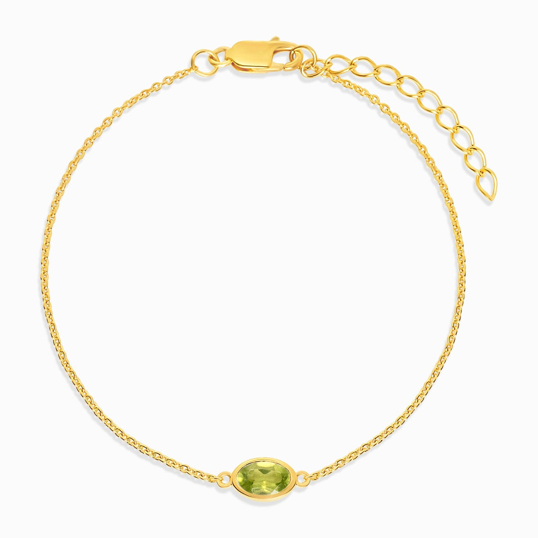 Armband mit grünem Peridot-Kristall in Gold. Edelsteinarmband mit Peridot in Gold.